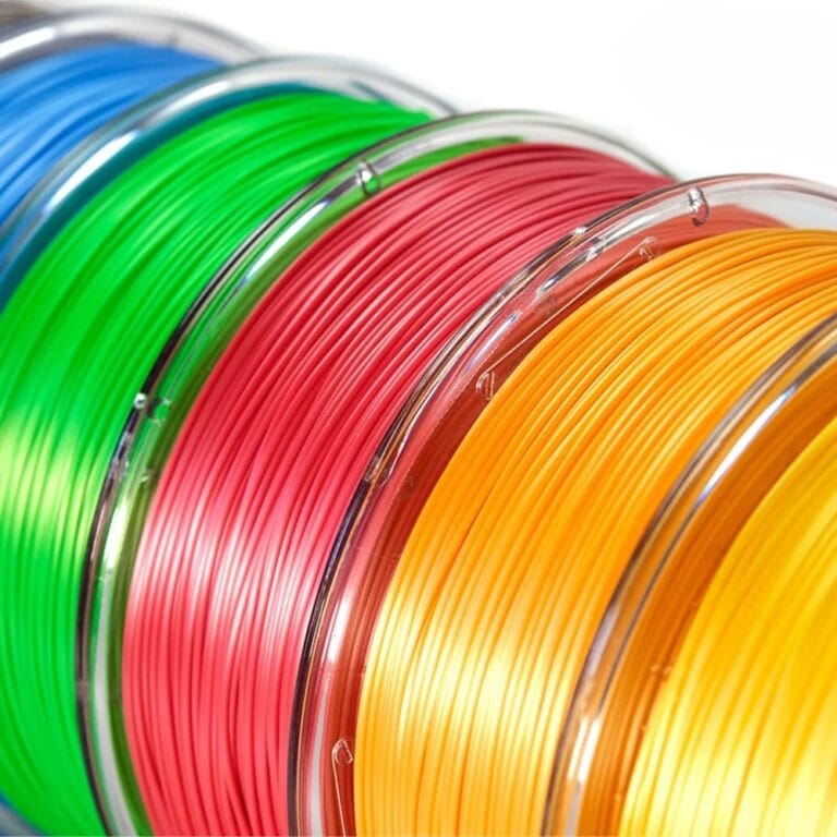 Filament spools for PLA, PETG, and ASA materials for 3D printing.